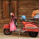 A Vespa is commonly seen transporting goods on the streets of Chinatown