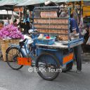 Local snack - grilled dried squids - at Bangkok's biggest flower market