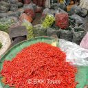 Chillies of different sizes and colors at  Bangkok's biggest flower market