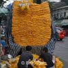 A truck unloading marigolds at the flower market to be made into garlands 