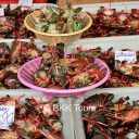Tied-up live crabs at the Railway market in Samut Songkram