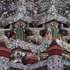 Demons supporting the stupa decorated with pieces of Chinese porcelain at Wat Arun, the Temple of Dawn
