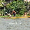 Family on long tailed boat on Chao Phraya river to Ayutthaya